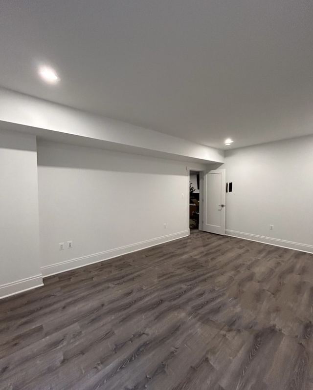 Finished basement with smooth drywall and fresh paint